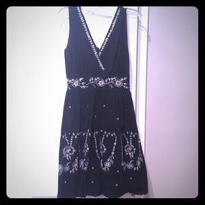 Black dress with white embroidery